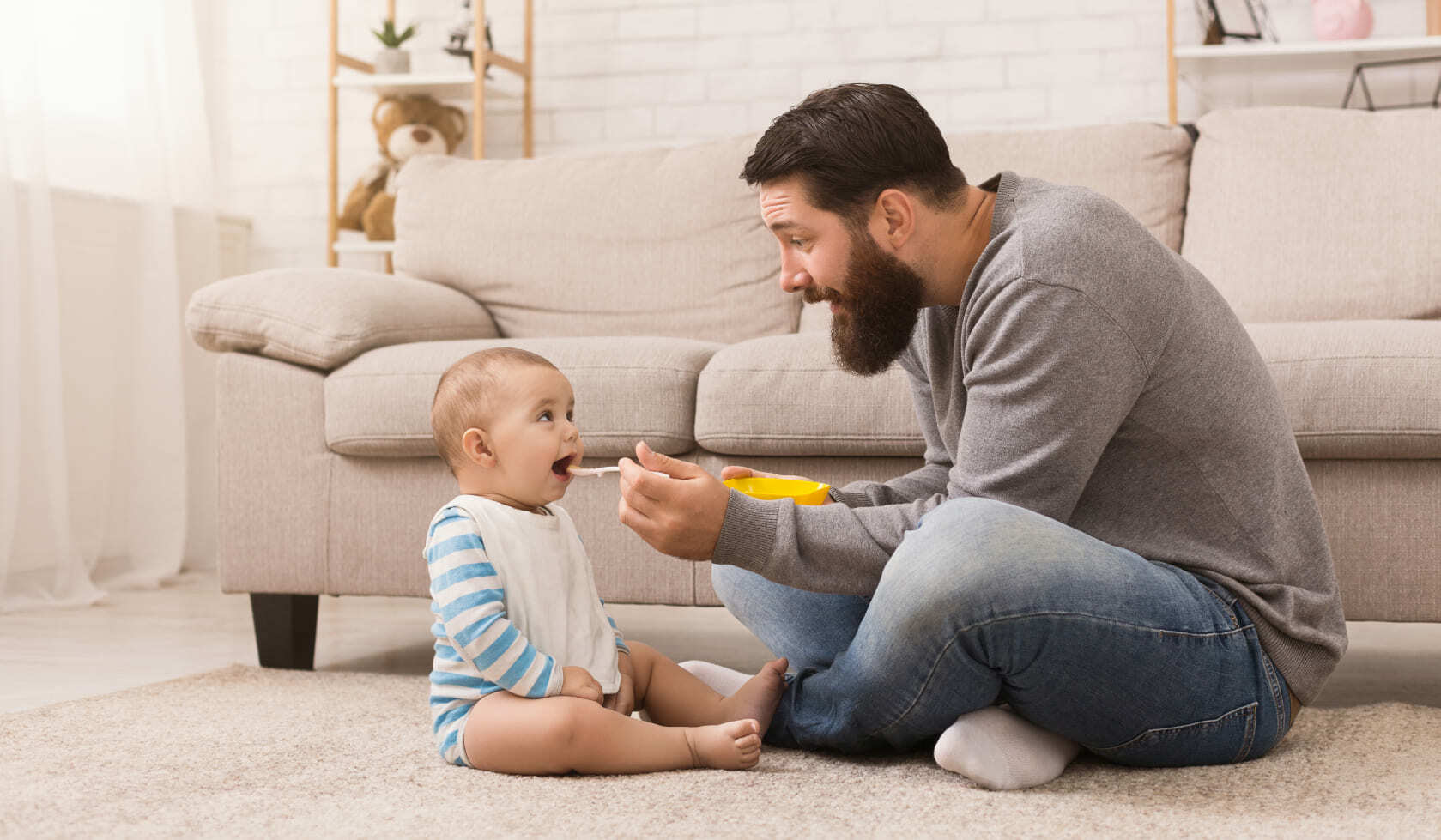 Father feeding child landscape